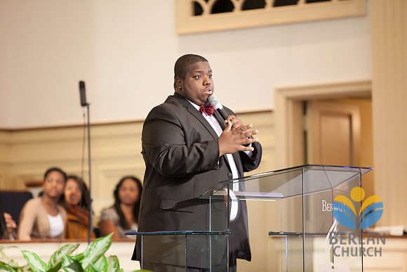 Associate Pastor Austin Humphreys collects offering