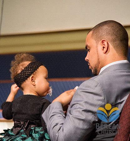 Pastor Boston glances at Riley.  (Official Berean SDA Church Photo by Burdie Henri)