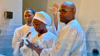 Pastor Long baptizing his niece