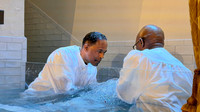 Pastor Long baptizing his niece