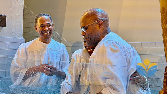 Pastor Long baptizing his niece