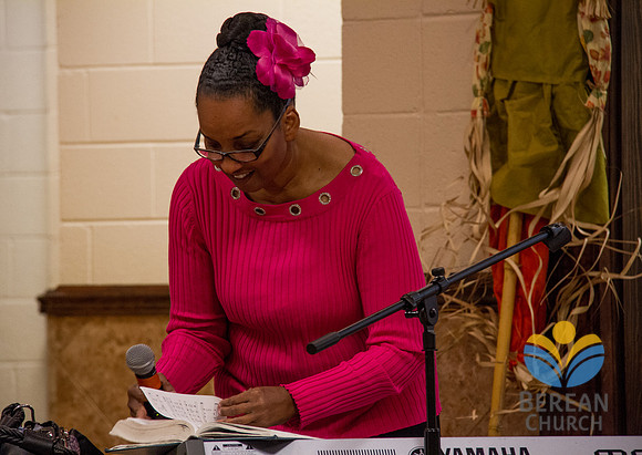 The choir learns to use the metric listing in the church hymnal.  Official Berean Photography (c) 2012 by Burdie Henri