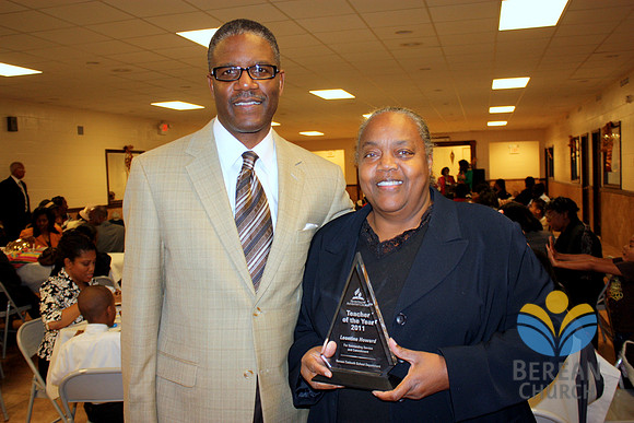 Leontine Howard with the "Teacher of the Year" award
