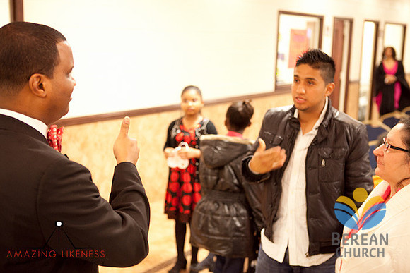 Pastor Byrd greets a deaf visitor