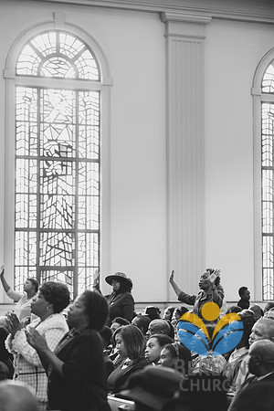 Congregation with hands raised