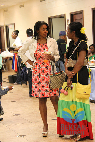 Two Church Members Discussing The Different Country Outfits