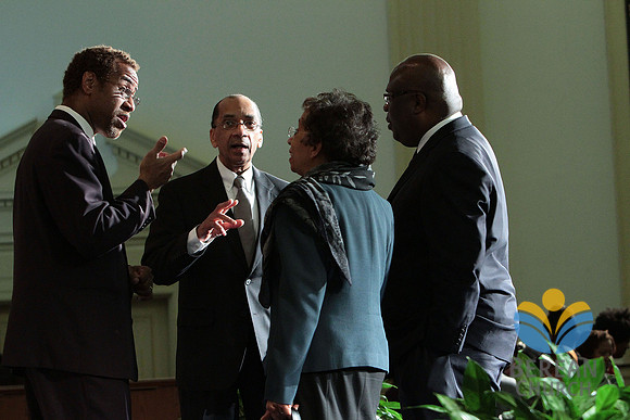 Senior Pastor Fredrick Russell speaks with friends after the concert. (Morgan State University Choir Concert)