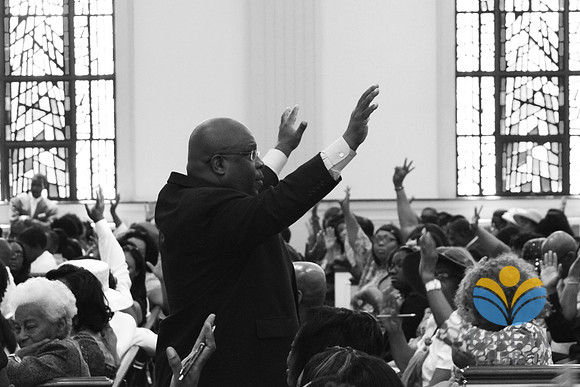 With raised hands, members and the Pastor Russell agree on a specific point about prayer. April 28, 2012 (Official Berean SDA Church Photo by David Stewart)